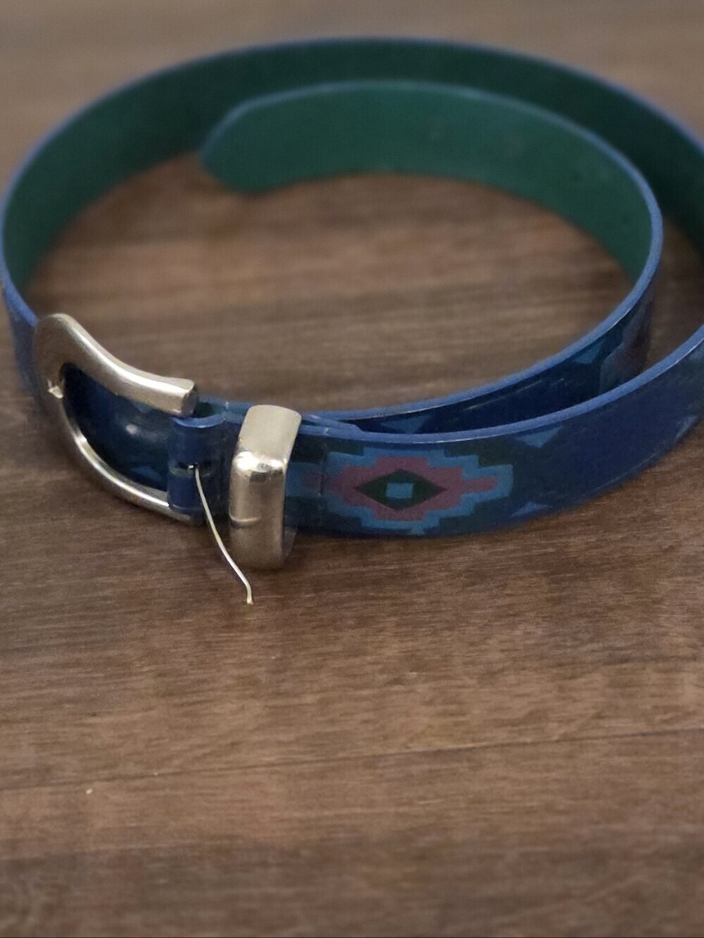 vintage  Southwestern-patterned blue and pink Aztec print belt with a silve